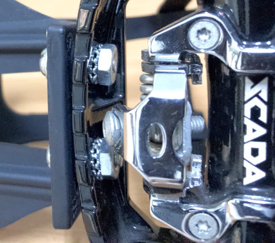 close up of toe pedal cage nuts