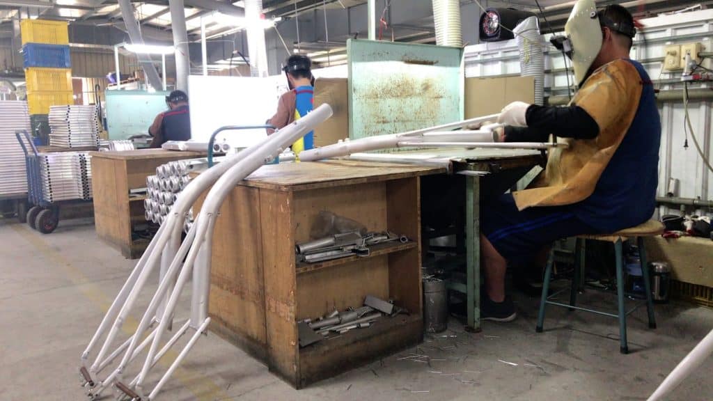 welder welding a bike frame