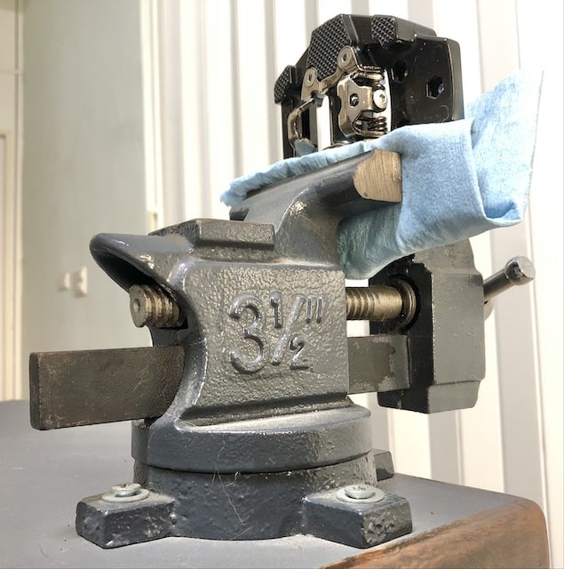 pedal in a vise ready to be worked on