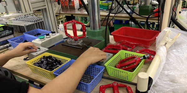 road bike flat pedals in production - assembly phase